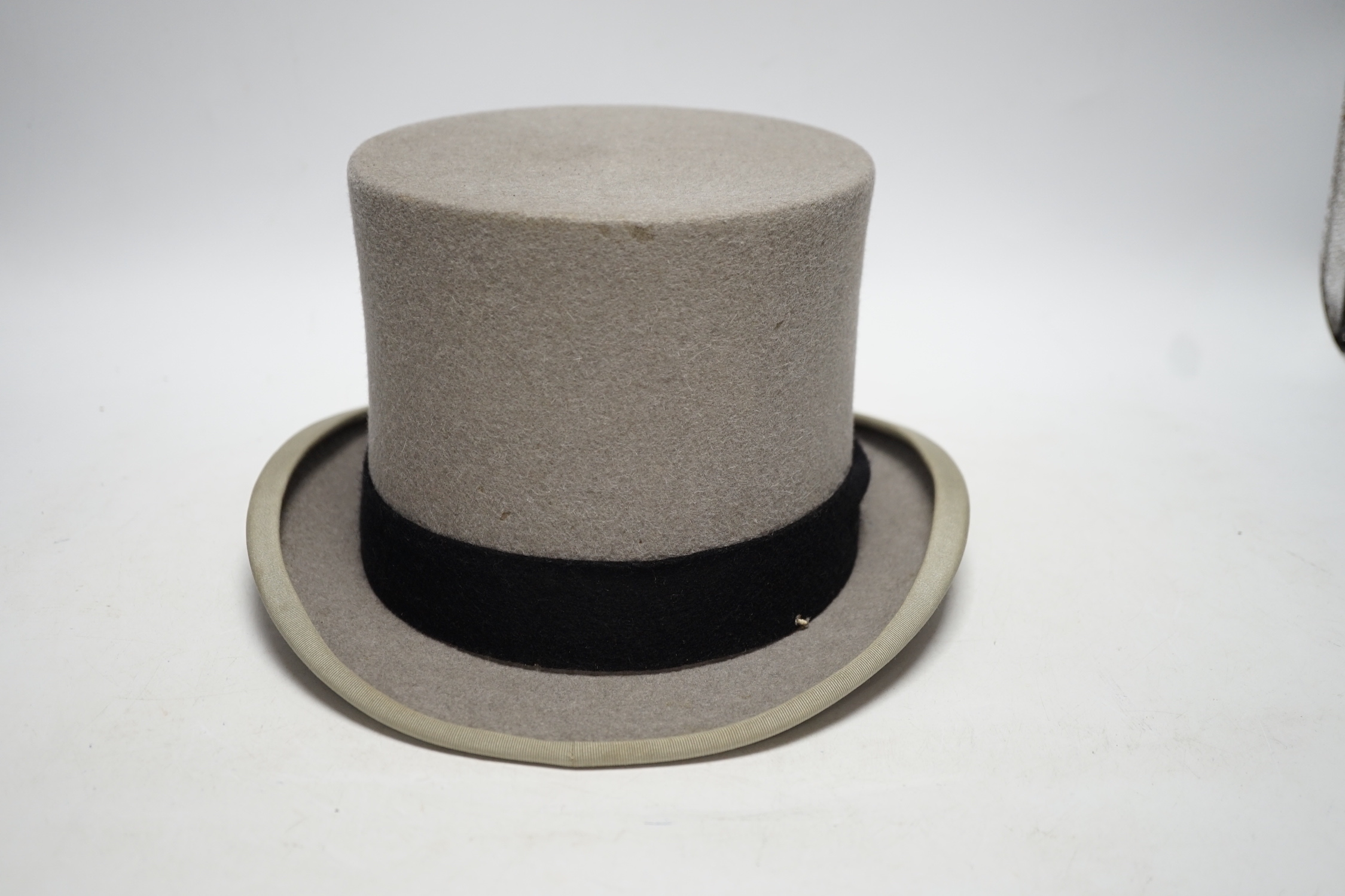 A Moss Bros grey top hat in Harrods box